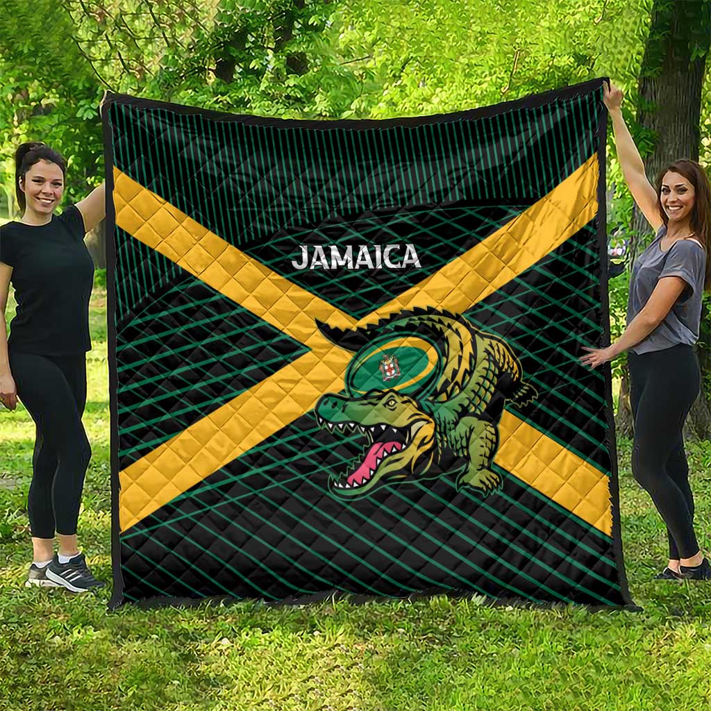 Jamaica rugby blanket quilt in green plaid with yellow X and crocodile emblem, outdoors