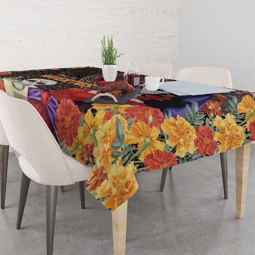 Rectangular tablecloth with large yellow-orange flowers over black and purple skull print