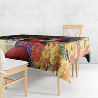 Floral tablecloth with black top border and multicolor leaf pattern on dining table