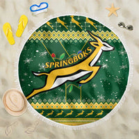 Round green beach blanket with fringe, Springboks logo and Christmas patterns