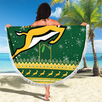 Round green beach blanket with fringe, large Springboks logo and patterned band
