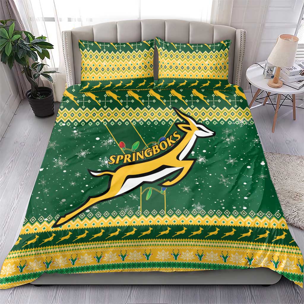 Green duvet cover with Springbok logo, yellow pattern borders, matching pillow shams