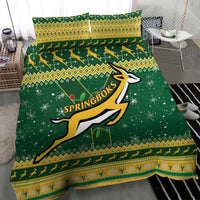 Green bedding set with Springbok logo, yellow aztec-style bands and white speckle accents