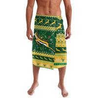 Green and yellow festive patterned lavalava shorts with animal and geometric stripes