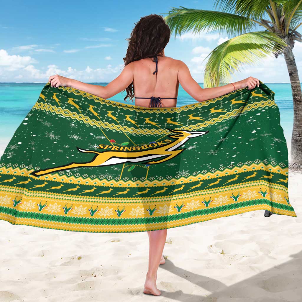 Green Springboks rugby sarong with yellow patterned hem, worn as a wrap