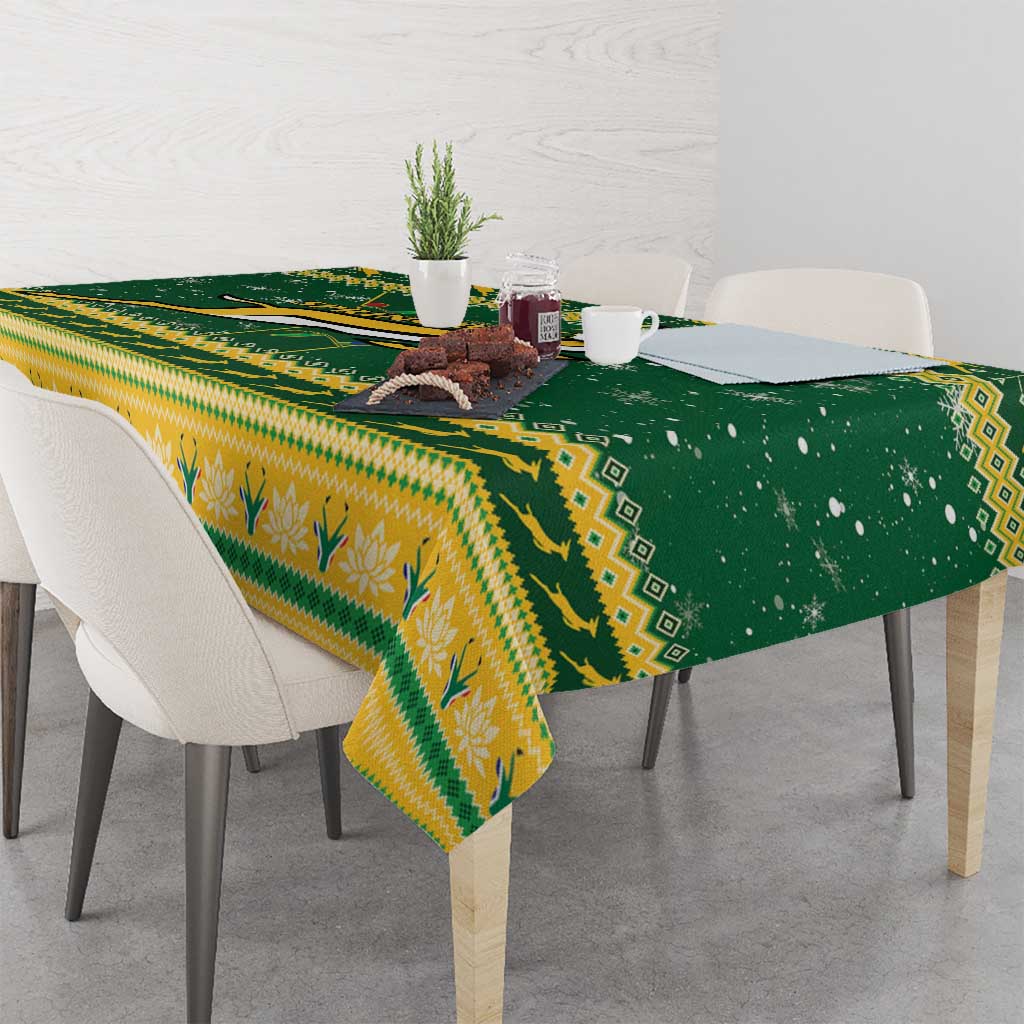 Green and yellow Christmas tablecloth with seasonal motifs and patterned border