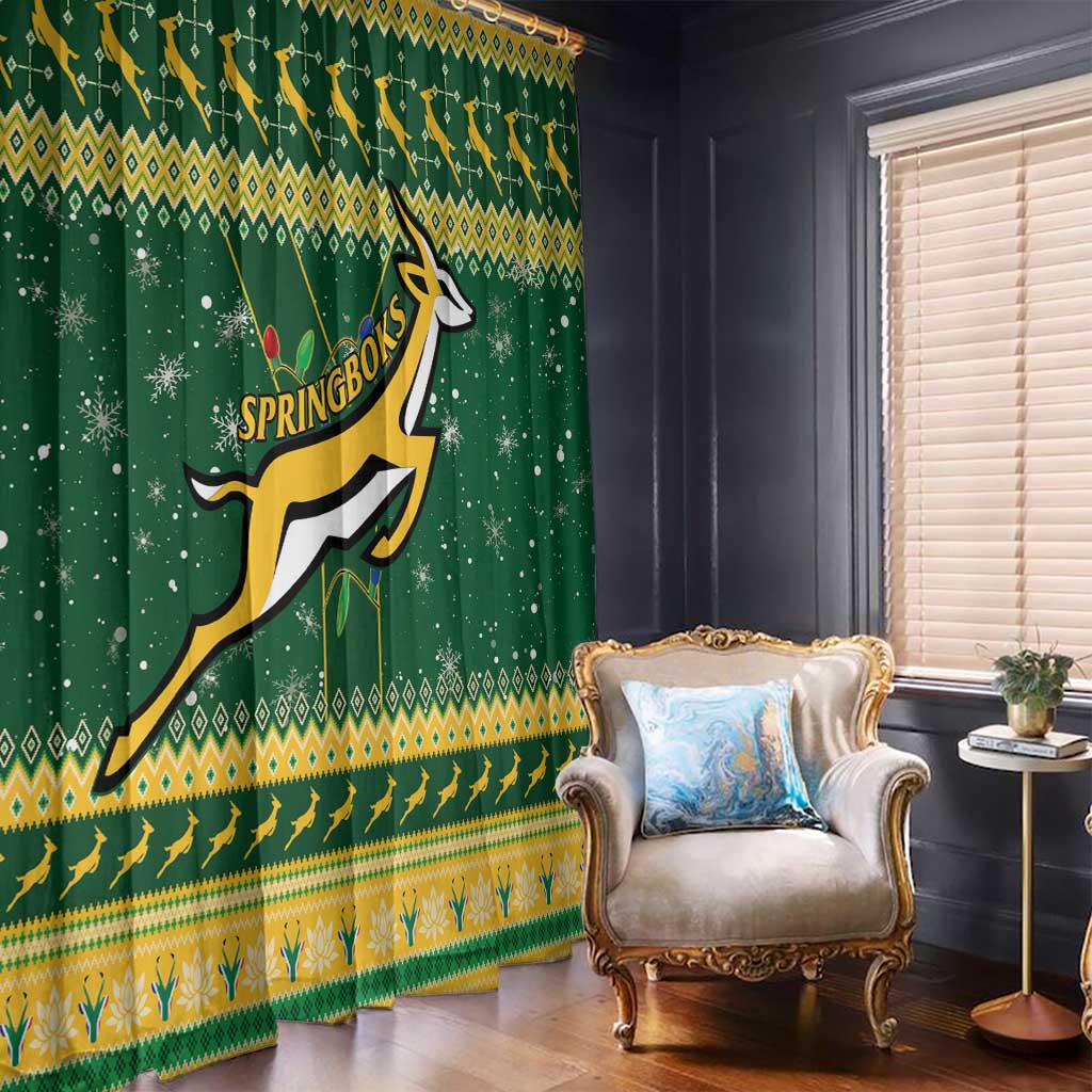 Dark green festive window curtains with Springboks logo, yellow border, snowflake accents