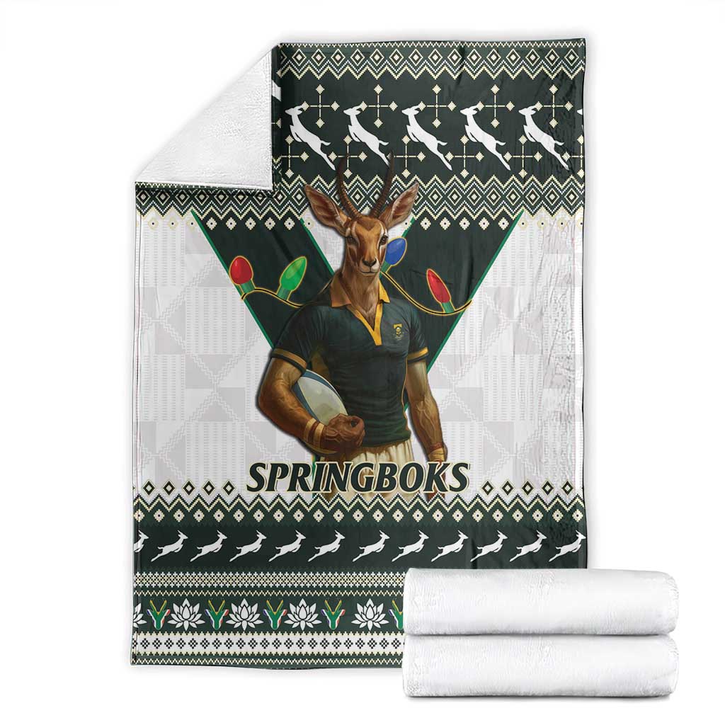 Springboks rugby blanket laid out with folded white stacks, dark green and white pattern
