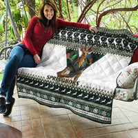Rugby quilt laid over couch cushion with Springboks text and dark green white pattern