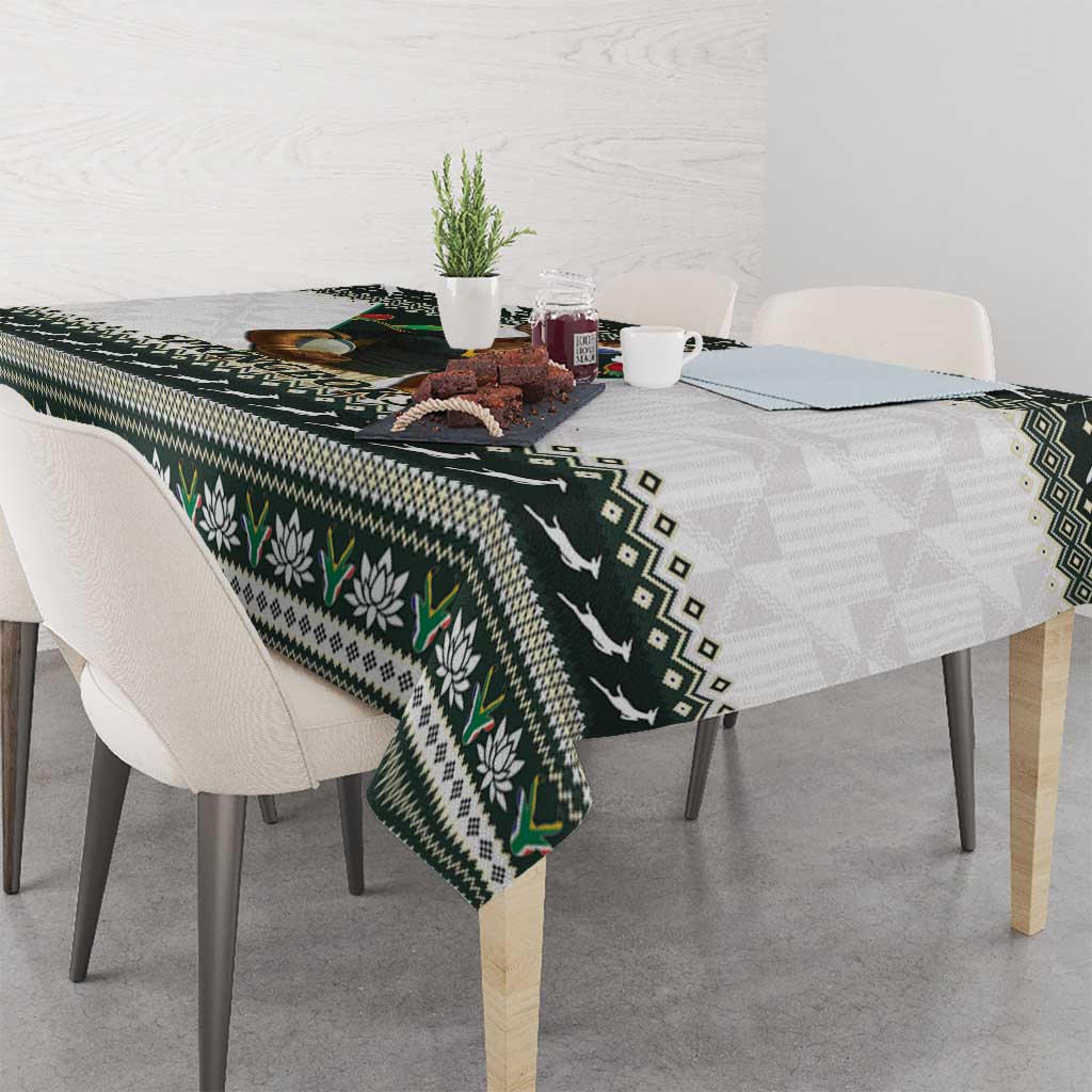 Christmas rugby tablecloth with green flower motifs and geometric diamonds on dark base