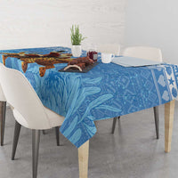 Blue Christmas tablecloth featuring Santa riding a leopard with leaf-style background pattern