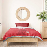 Red pirate-themed duvet and pillow set with parrot graphic and shield crest, shown on bed