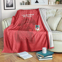 Red football blanket with 'YOUR TEXT' and 'The Pirates' graphic, draped over a couch