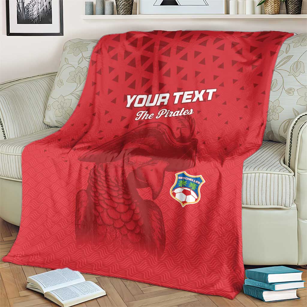 Red football blanket with 'YOUR TEXT' and 'The Pirates' graphic, spread across a couch