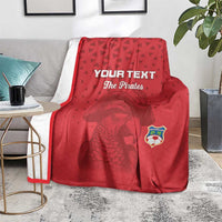 Red football blanket with 'YOUR TEXT' and 'The Pirates' graphic, draped over the edge