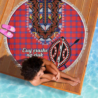 Round shuka beach blanket, red-blue plaid with tribal emblem center and white fringed border