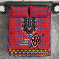 Red and blue plaid duvet cover with Maasai beadwork medallion and patterned trim