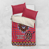 Red and blue plaid duvet cover set with Maasai beadwork medallion and two red pillowcases