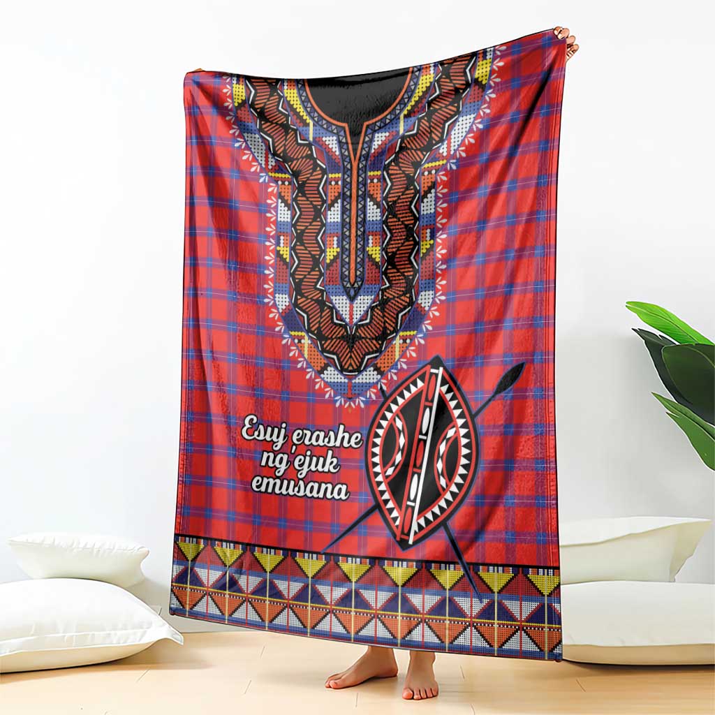 Red plaid shuka blanket with central black-and-white motif and colorful geometric border