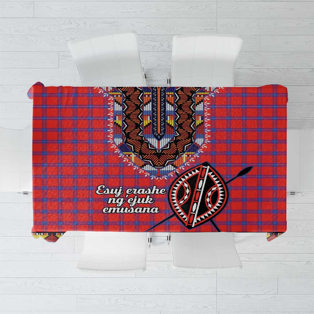 Red and blue plaid tablecloth with black-and-white tribal dashiki beadwork centerpiece