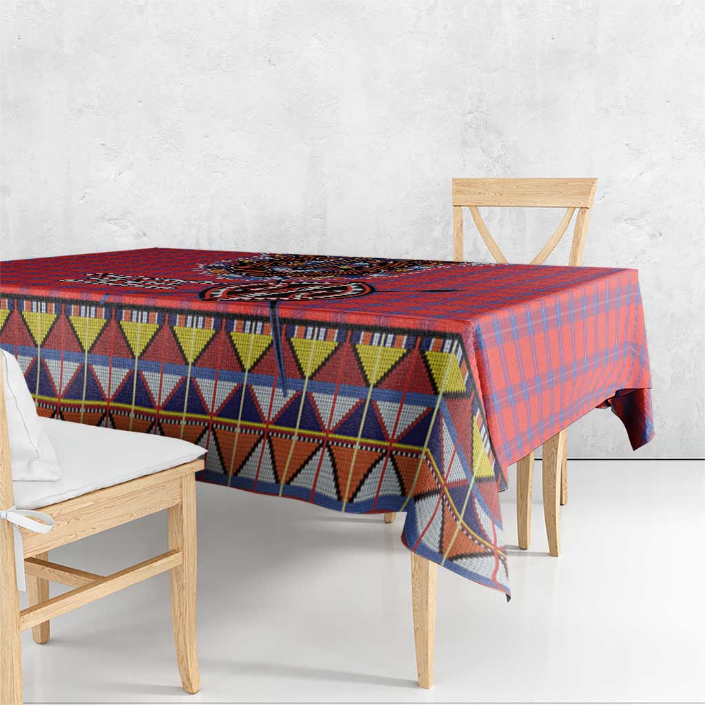 Red plaid tablecloth corner with multicolor zigzag and diamond band trim