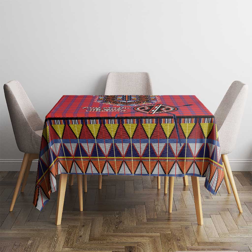 Red blue plaid tablecloth with multicolor geometric band and central motif