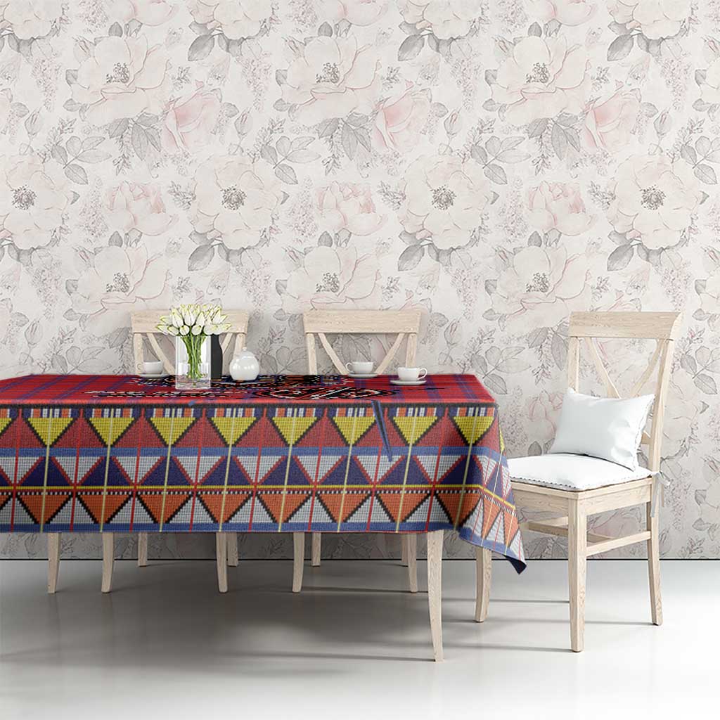 Red blue plaid tablecloth with multicolor geometric band and red edge border