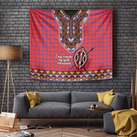 Red and blue plaid Maasai shuka tapestry with central beadwork face and shield motif