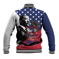 Blue baseball jacket with striped ribbed collar, star print, and MLK back graphic