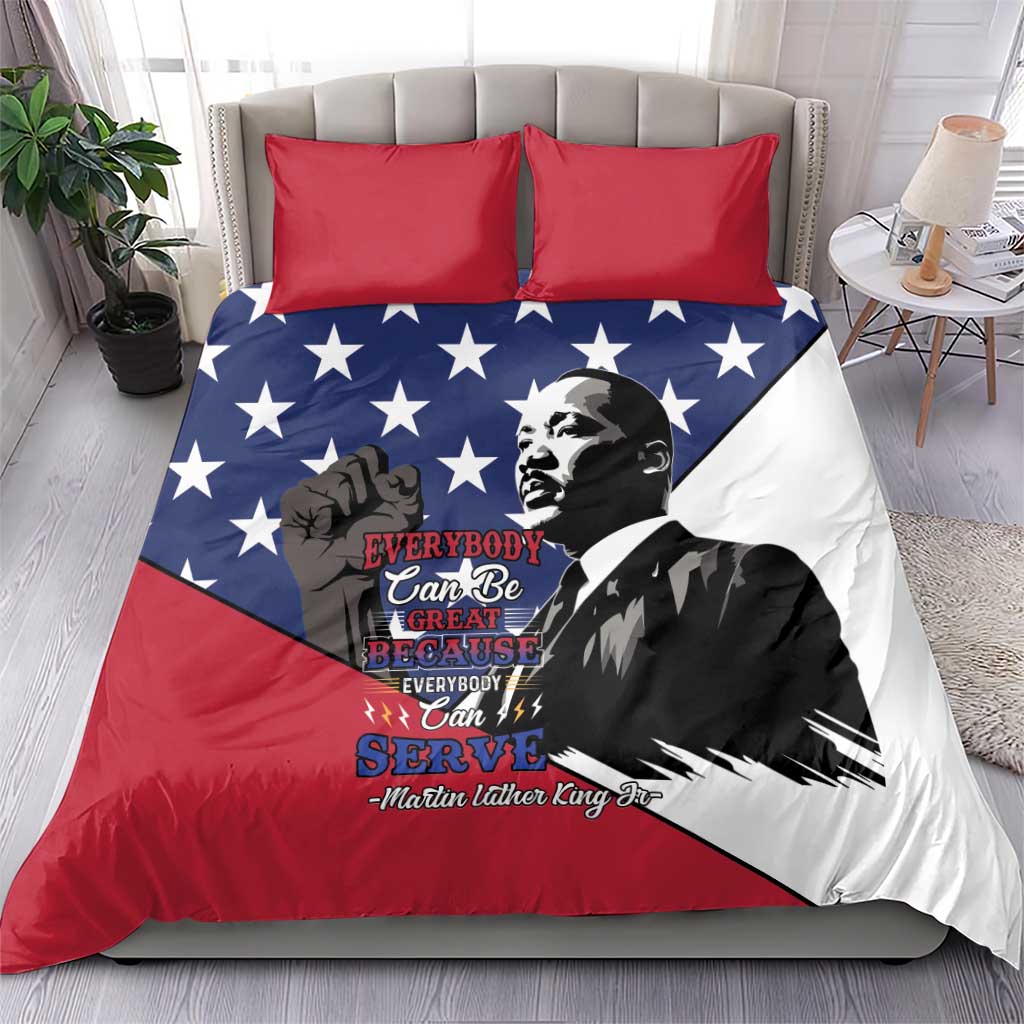 Patriotic bedding set with blue stars, red/white MLK graphic, two red pillows on bed