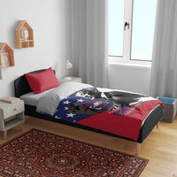 Patriotic bedding set on bed with blue star MLK graphic and red/white design, two red pillows