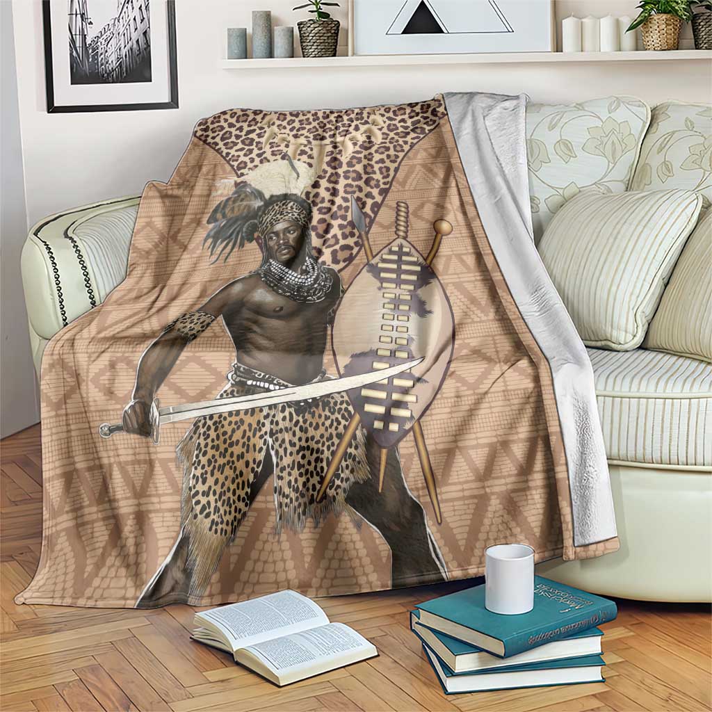 Brown blanket with Zulu warrior portrait, leopard print, spear and shield graphic