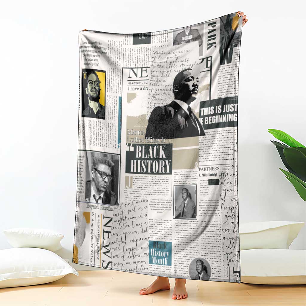 White newspaper-style blanket with Black History headline and portrait blocks, spread out
