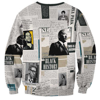 Unisex crewneck sweatshirt, light gray, newspaper-style portraits and Black History text on sleeves