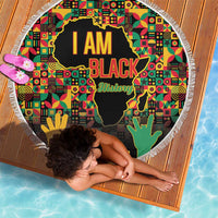 Black History Month beach blanket, round fringe edge, “I AM BLACK History” on colorful map
