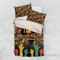 I AM Black bedding set shown as folded duvet and two matching pillowcases.