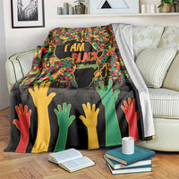 Black History Month throw blanket with “I AM BLACK” graphic, hands silhouette, multicolor pattern
