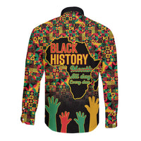 Unisex long-sleeve button shirt with BLACK HISTORY text, colorful pattern, and hand graphics