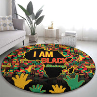 Round graphic history rug with African map silhouette, I AM BLACK lettering, multicolor hands