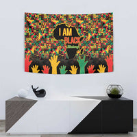 Colorful “I AM BLACK” Black History Month tapestry with raised hands and world map silhouette