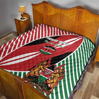 Kenya flag style quilt blanket on a bed with red, white, green stripes and crest shield
