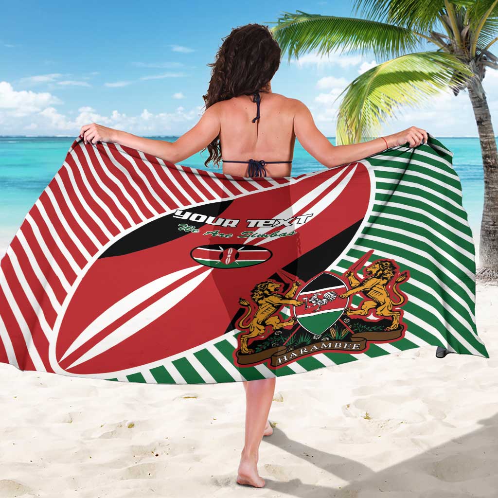 Red, green, and black rugby flag sarong showing full back print with crest