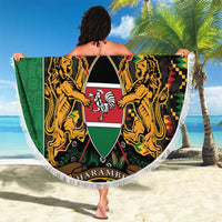 Round green Kenya beach blanket showing coat of arms shield, gold lions, white fringe