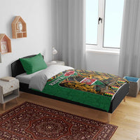 Green Kenya bedding set with coat of arms print and kente zigzag pattern, two pillowcases.