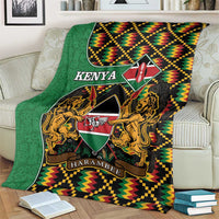 Green Kenya-themed blanket draped on couch, featuring coat of arms, lions, shield, and trim