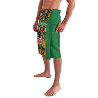 Green wrap skirt with colorful kente border panel and Kenya crest, side view