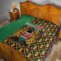 Green Kenya kente quilt on bed with crest emblem, lions, and multicolor pattern