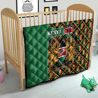 Green Kenya kente quilt on toddler bed with crest emblem, lions, and multicolor border