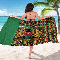 Kenya kente-pattern sarong coat, back view, green base with KENYA HARAMBEE crest