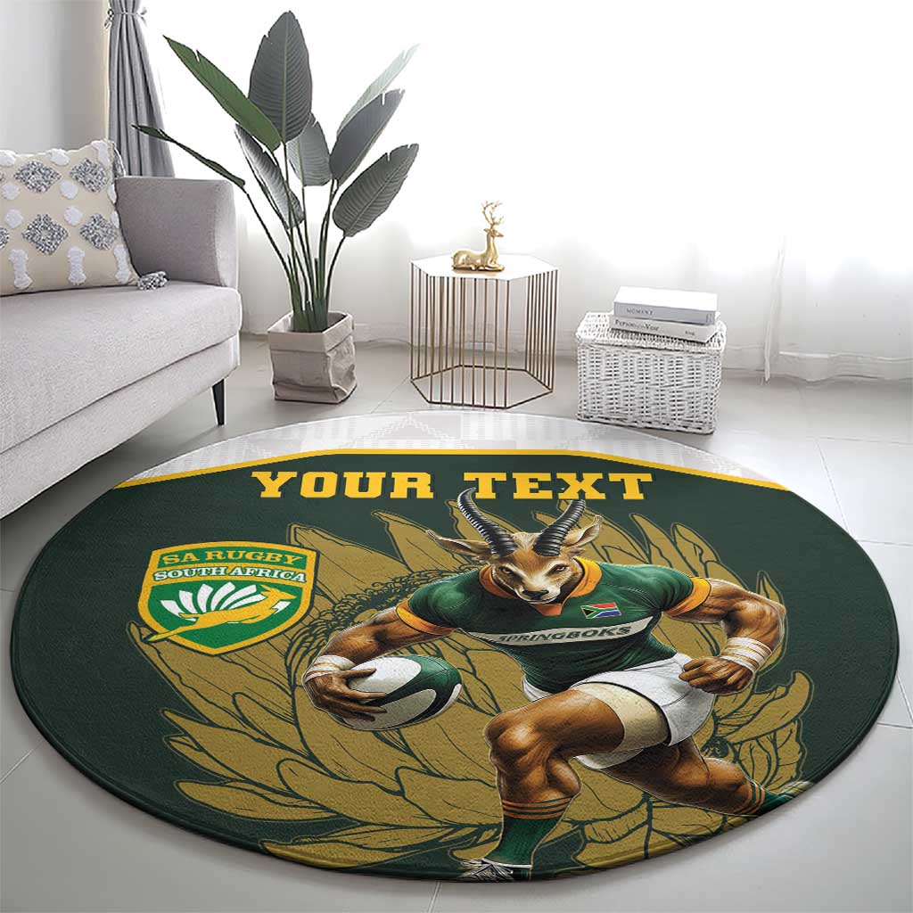Round green rug with cartoon Springboks mascot, leaf pattern, and “YOUR TEXT”